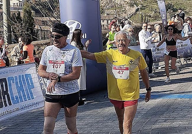 Juan López at the finishing line after running a marathon.